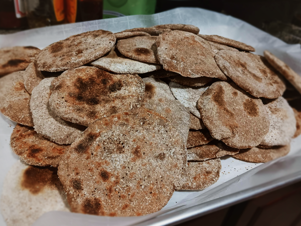 The image shows small 3 inch diameter flat breads in a pile on a plate.
